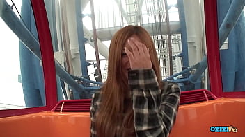 A red haired individual has her hands soiled in public