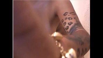 Sexy woman with perfect body getting oiled up