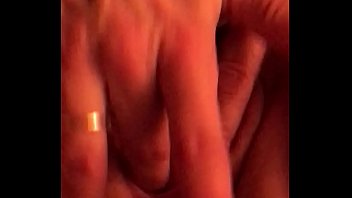 Playing with her pussy on the bed