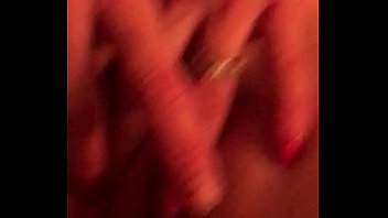 Playing with her pussy on the bed