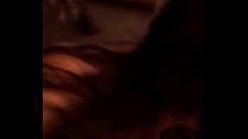 Playing with her pussy on the bed