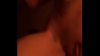 Playing with her pussy on the bed