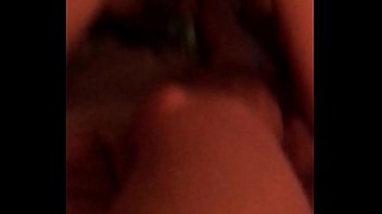 Playing with her pussy on the bed