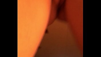 Playing with her pussy on the bed