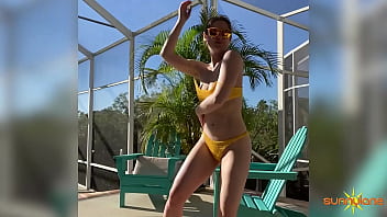 The hot blondie sunny lane in bikini shakes her ass outdoors