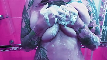 Curvy girl washes her huge tits with soap and rubs them on the glass Curvy girl washes her huge tits with soap and rubs them on the glass