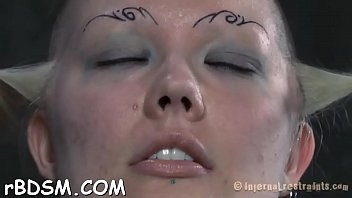 Angel gets her neck restrained and knockers clamped