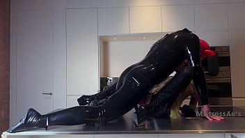 Pigbugs latex doll and pig squirting on the countertop