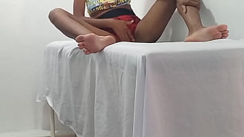 A beautiful brunette massage therapist waits for a client to arrive in her office she moans while making movements showing her buttocks and breasts