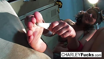 Busty brunette has some foot fetish fun