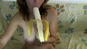 Natural busty girl sucks a banana