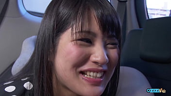 An asian teenager simultaneously uses a vibrator on her genitals while performing oral sex