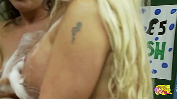 These three brunettes get their hands on a blonde and fuck her in car wash