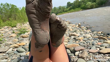 Dirty feet in pantyhose teasing outdoor