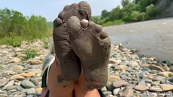 Dirty feet in pantyhose teasing outdoor
