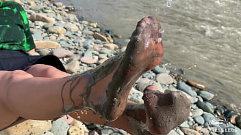 Dirty feet in pantyhose teasing outdoor