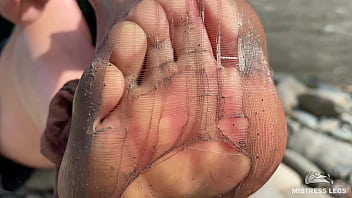 Dirty feet in pantyhose teasing outdoor