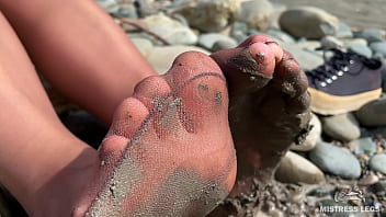 Dirty feet in pantyhose teasing outdoor