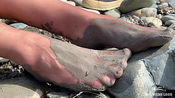 Dirty feet in pantyhose teasing outdoor