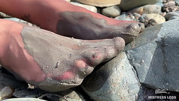Dirty feet in pantyhose teasing outdoor