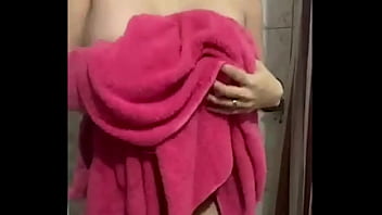 She just showered and slowly dries her naked body – tits & pussy tease