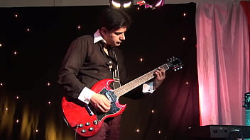 The guitarist fucks a cute blonde lassie and sprays her body with his urine at the end