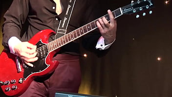 The guitarist fucks a cute blonde lassie and sprays her body with his urine at the end