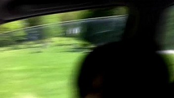 Daring babe flashing her tits in public