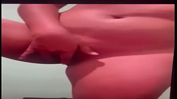 Latina enjoying herself in front of the camera