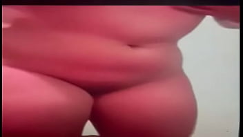 Latina enjoying herself in front of the camera