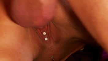 Emma butt spreads her legs so you can see her clit piercing as she's fucked