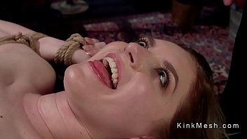 Chained lesbian sub gets anal strap on