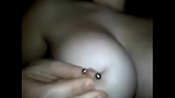 Girlfriend plays with her pierced nipples 4