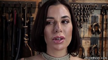 Busty and hairy brunette tied to wooden beam in standing position gets pussy rubbed Busty and hairy brunette tied to wooden beam in standing position gets pussy rubbed