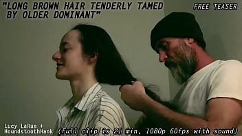 Long brown hair tenderly tamed by older dominant0