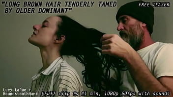 Long brown hair tenderly tamed by older dominant0