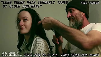 Long brown hair tenderly tamed by older dominant0