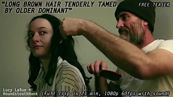 Long brown hair tenderly tamed by older dominant0