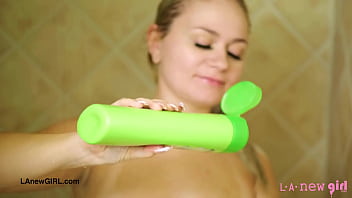 Pretty teen blonde enjoys a sensual bath