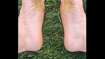 Feet flexing in the grass