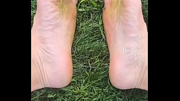 Feet flexing in the grass