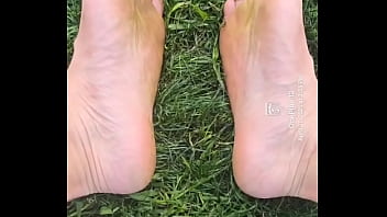 Feet flexing in the grass