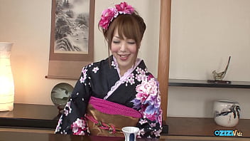 An asian girl feigns disinterest until an erect penis is directed towards her face