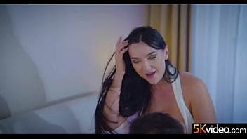 With her tits busting out of her dress and the tops of her lacy thigh highs visible just beneath her dress