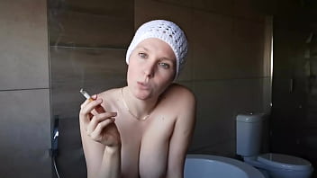 Cute brunette smoking