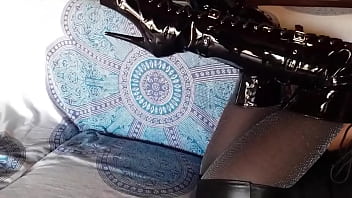 Total black with fishnets pantyhose and boots over the knee