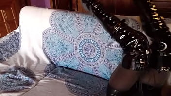 Total black with fishnets pantyhose and boots over the knee