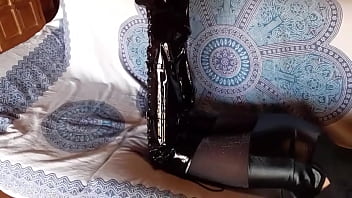 Total black with fishnets pantyhose and boots over the knee