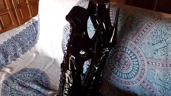 Total black with fishnets pantyhose and boots over the knee