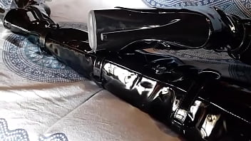 Total black with fishnets pantyhose and boots over the knee